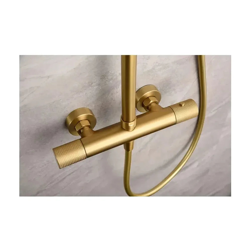 Detalle de acabado y materiales de Conjunto de ducha termostática de acero inoxidable con acabado oro cepillado Line de Imex