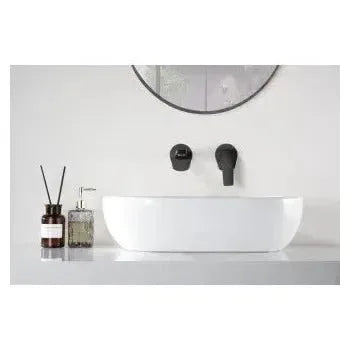 Vista lateral y perspectiva de Grifo monomando empotrado para lavabo hecho de latón con acabado negro mate Delos de Imex