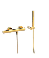 Grifo monomando mural para ducha con ducha de mano anticalcárea acabado dorado Study Tres