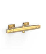 Grifo termostático mural de dos vías con conexión para barra y acabado oro mate BASIC de Over Wall Tres
