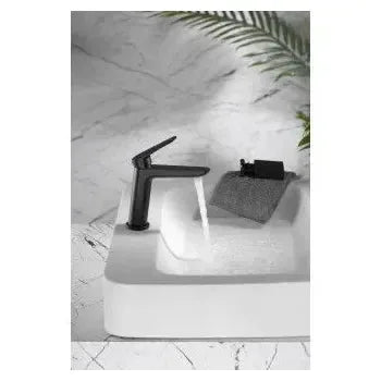 Vista lateral y perspectiva de Grifo monomando de lavabo con un cartucho cerámico de 35 mm en color negro mate Belgica de...