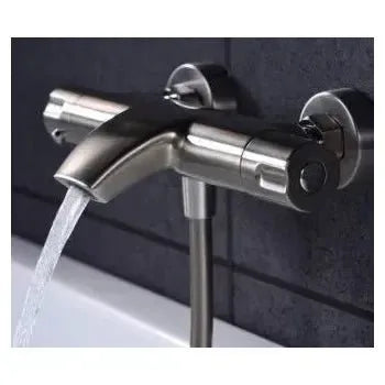 Vista lateral y perspectiva de Grifo termostático para bañera o ducha fabricado en acero inoxidable de acabado cromado...